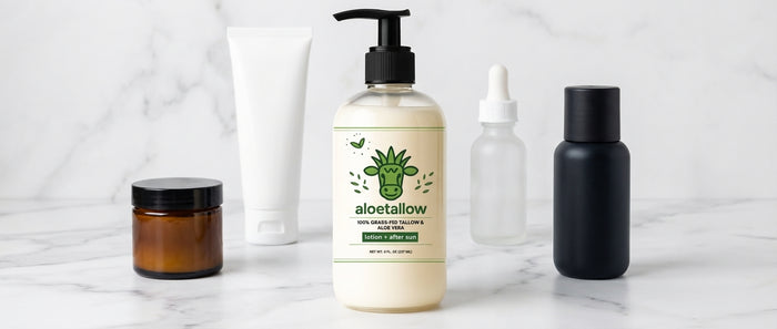 Aloetallow bottle surrounded by 5 tallow lotion options on marble